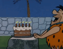 fred-flintstone-blow-out-candles (1).gif