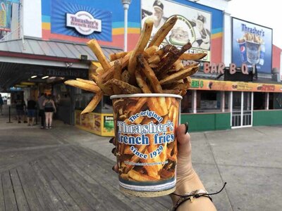 person-holding-thrashers-french-fries-in-front-of-store-front-1920x1440-1-768x576.jpg