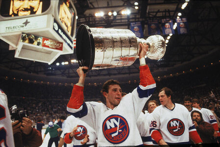 brent-sutter-holds-up-the-stanley-cup-b-bennett.jpg